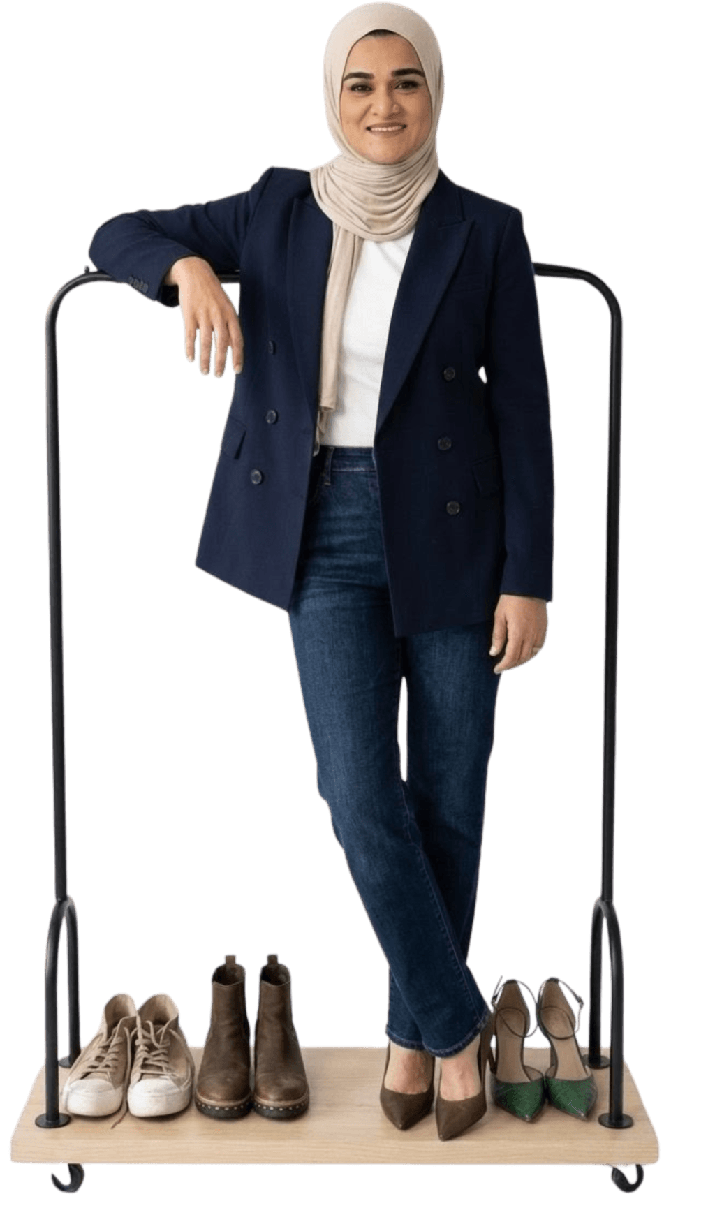 Khansa Khatoon standing beside clothing rack